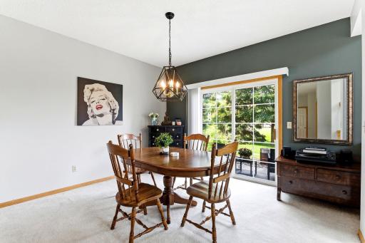 Beautiful formal dining room that flows into the private cozy patio space.