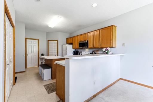 Kitchen is in excellent shape with original solid oak, linoleum flooring and appliances.