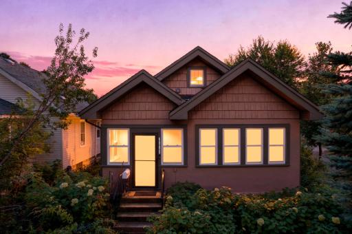 Charming stucco 3 bedroom with mature landscaping and distinctive double gables creates instant curb appeal.