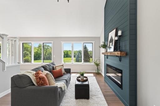 The livingroom overlooks the back yard and fenced pasture