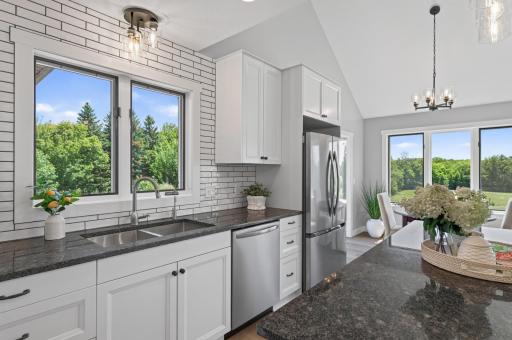 Kitchen window over new sink, faucets and a water treatment system