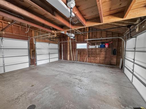 Drive through garage with three new openers & doors