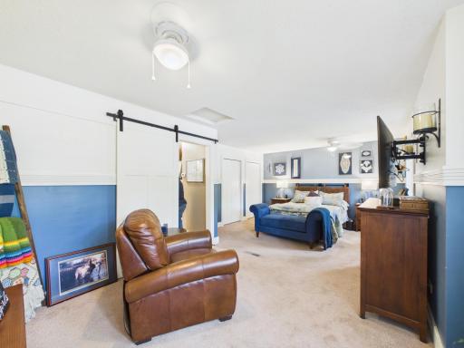 Huge main floor primary bedroom with modern barn door