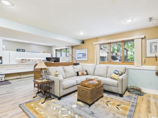 Full look-out windows add ample natural light in the lower level family room