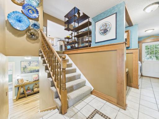Tiled entryway with laundry room