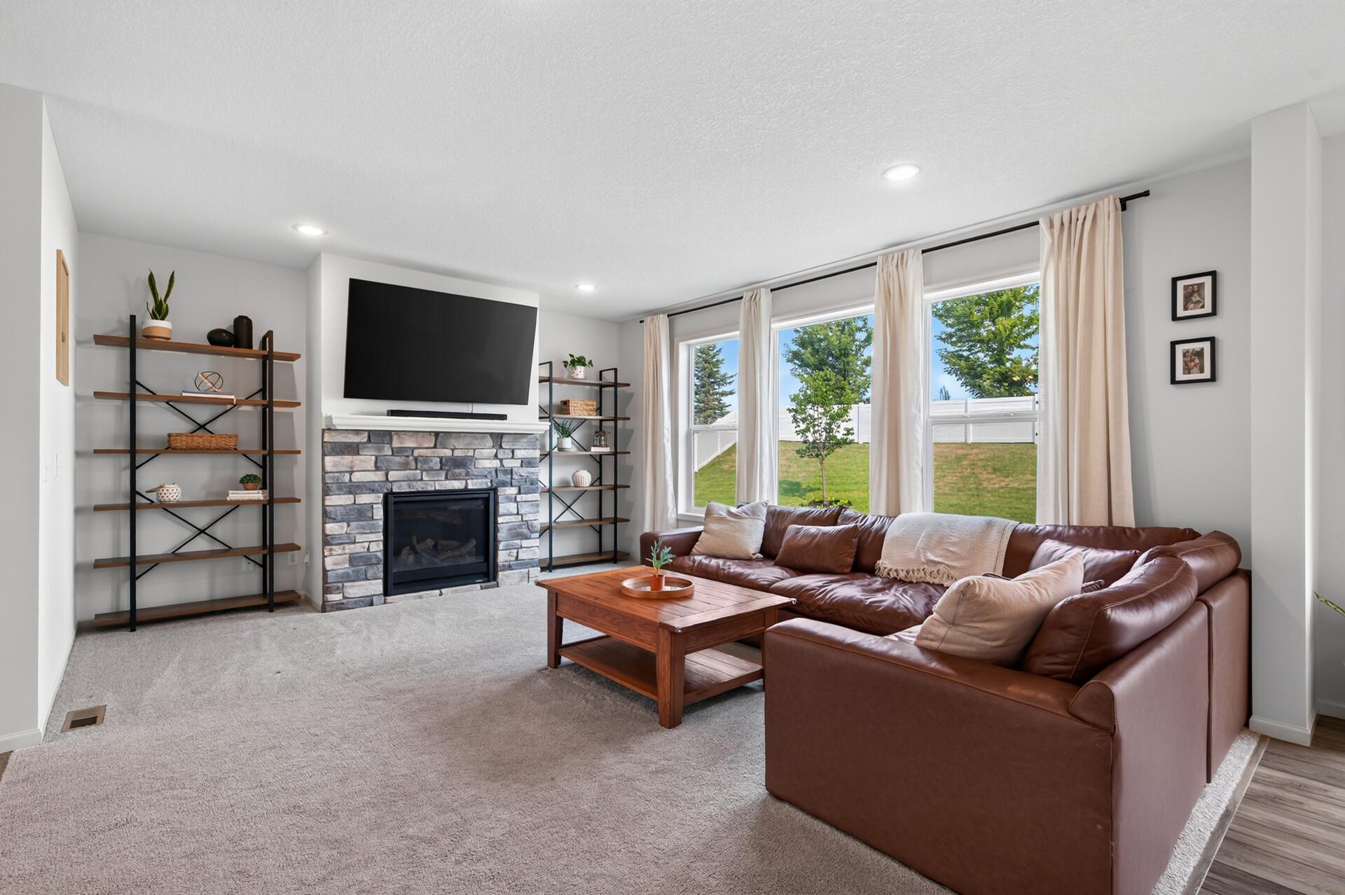 Living room with beautiful large windows looking out to backyard