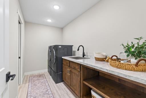 Dedicated Laundry Room Adjacent to Master Bedroom Closet