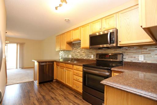 Hard Surface Countertops, Ceramic Backsplash and Stainless-Steel Appliances!