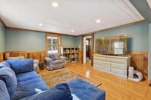 Living room with hardwood floors and lots of natural light