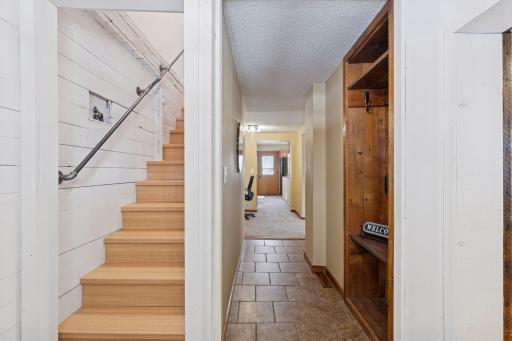 Hallway and stairs to newly finished upper level