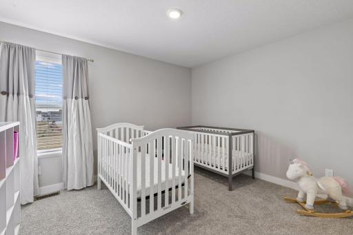 One of four bedrooms on the upper level