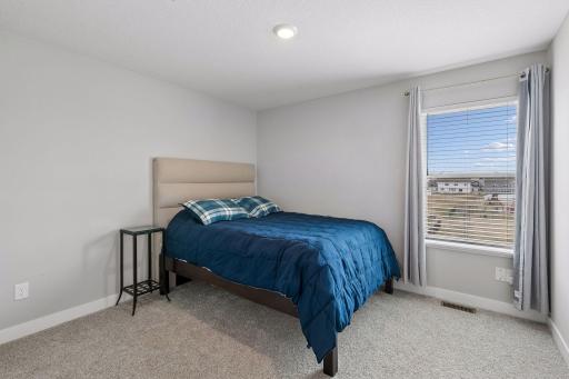 One of four bedrooms on the upper level