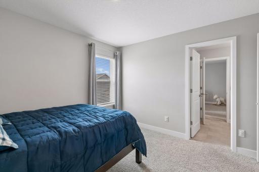 One of four bedrooms on the upper level
