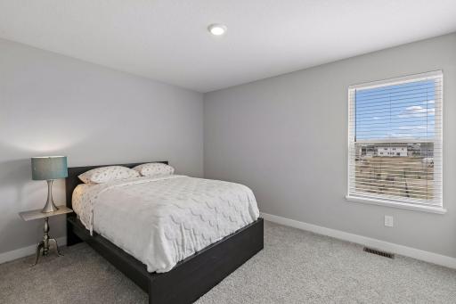 One of four bedrooms on the upper level