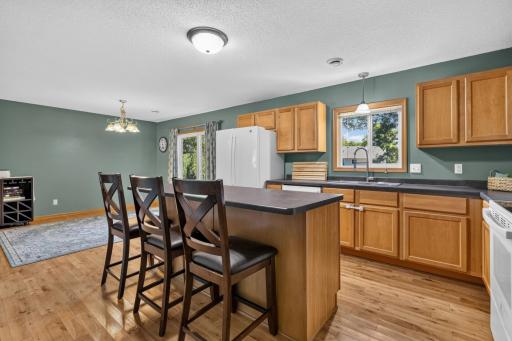 Kitchen appliances features refrigerator, dishwasher, stove/oven and microwave.