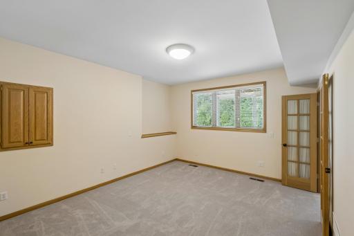 4th bedroom in the lower level has french doors