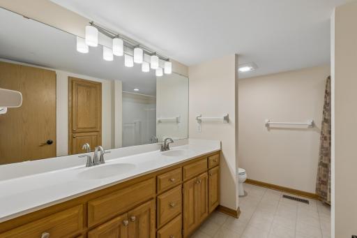 Lower level full bathroom also has a double sink vanity