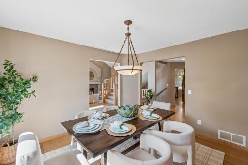 The formal dining room is filled with natural light