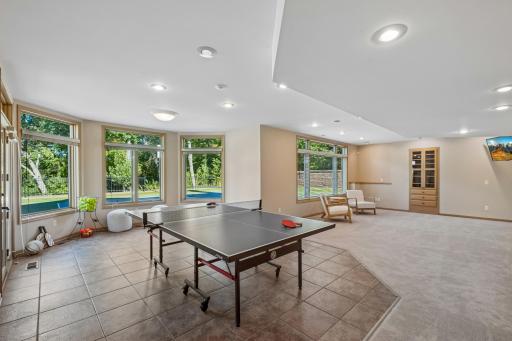 The walkout lower level features a large family room, game or exercise area, the fourth bedroom and the third full bathroom