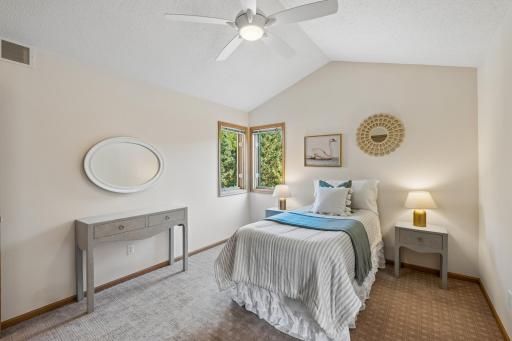 Bedroom number three is cozy, tucked away in the corner of the house