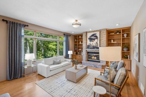 The family room features a wood burning fireplace