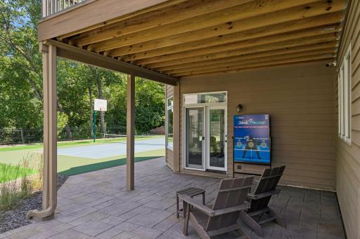The stamped concrete patio stays dry due to the under decking drainage system. Any moisture that collects on the desk is collected and runs off via the underground gutter system.
