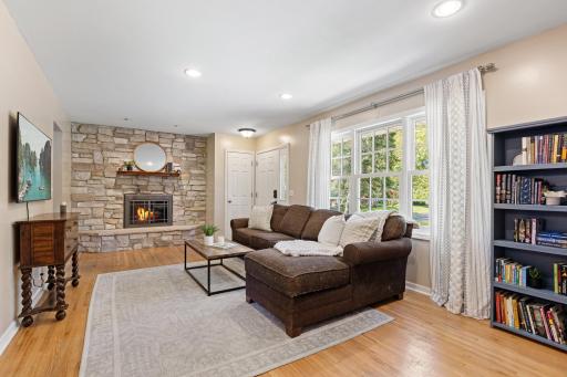 Bright and spacious living room with a wood burning fireplace