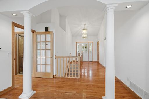 This spacious entry way has beautiful hardwood floors,