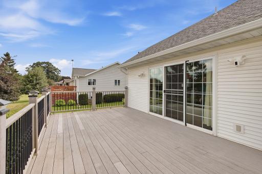 Triple panel patio doors really open up the home to the wonderful deck.