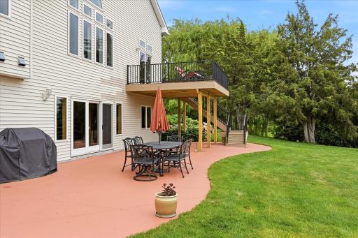 Walkout access leads directly to the patio and expansive backyard setting.