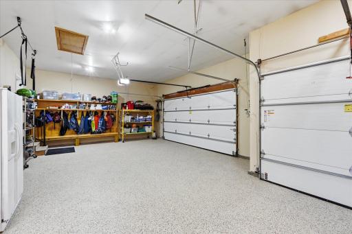 Heated garage addition features radiant in-floor heat and an overhead heater for year-round comfort.