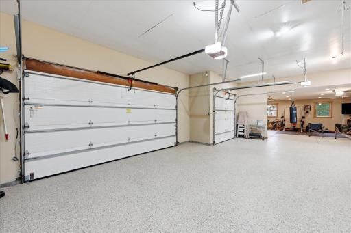 Heated garage addition features radiant in-floor heat and an overhead heater for year-round comfort.