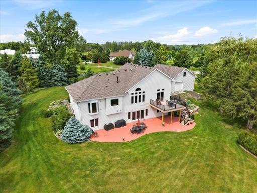 Walkout rambler situated on 2.5 scenic acres surrounded by mature trees, established gardens, and peaceful views.