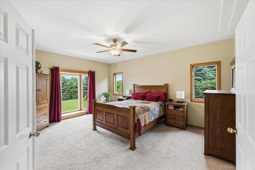 The primary suite offers a private retreat featuring French doors and thoughtfully designed finishes.