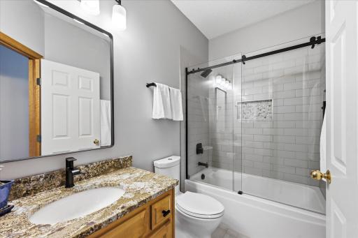 Beautifully updated bathroom finishes blend timeless style with everyday functionality.