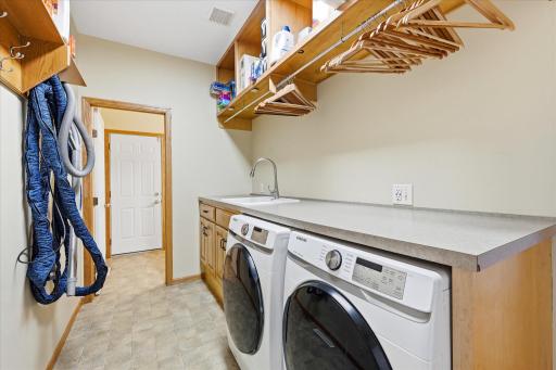 Convenient main-level laundry room adds efficiency to daily routines.