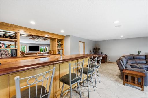 Built-in bar area creates a natural gathering space for hosting and entertaining.