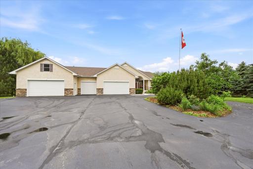 Impressive 5-car garage offers exceptional vehicle storage, workshop space, and versatility.