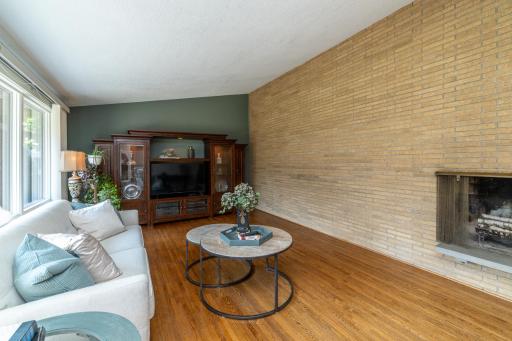 Living Room with Floor to Ceiling Brick Fireplace and Vaulted Ceilings