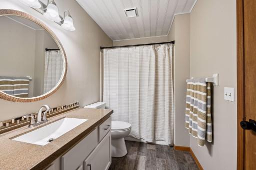 7229 Main floor full bath (walk through from primary bedroom)