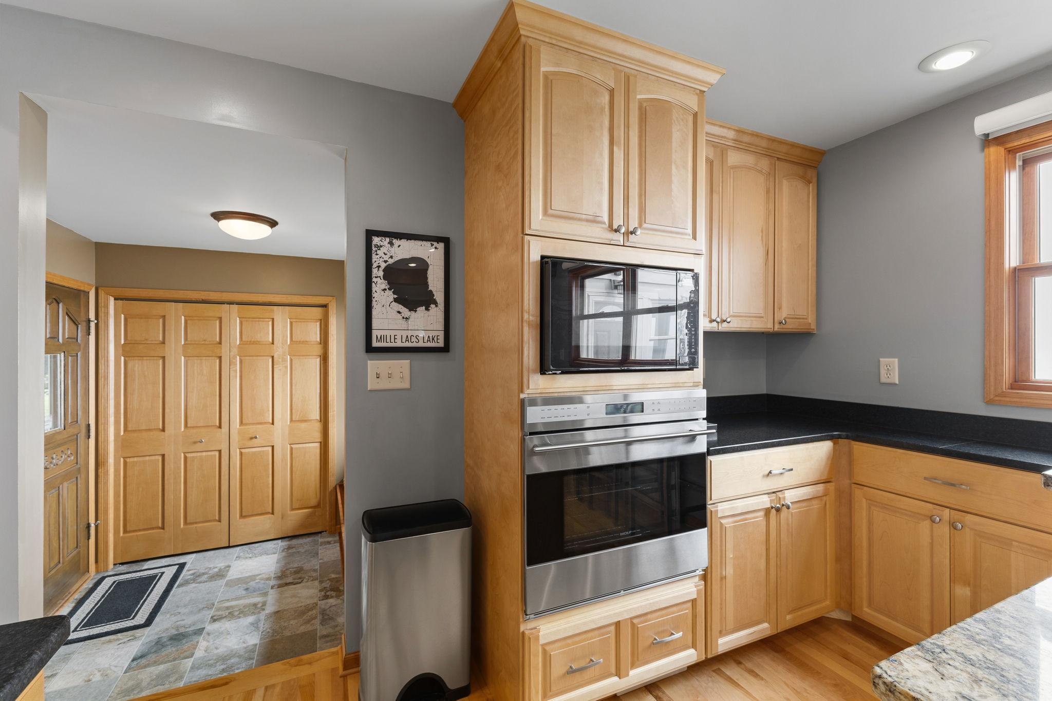 Beautiful custom maple cabinetry, premium built-in appliances, and abundant storage make this thoughtfully designed kitchen as functional as it is elegant.