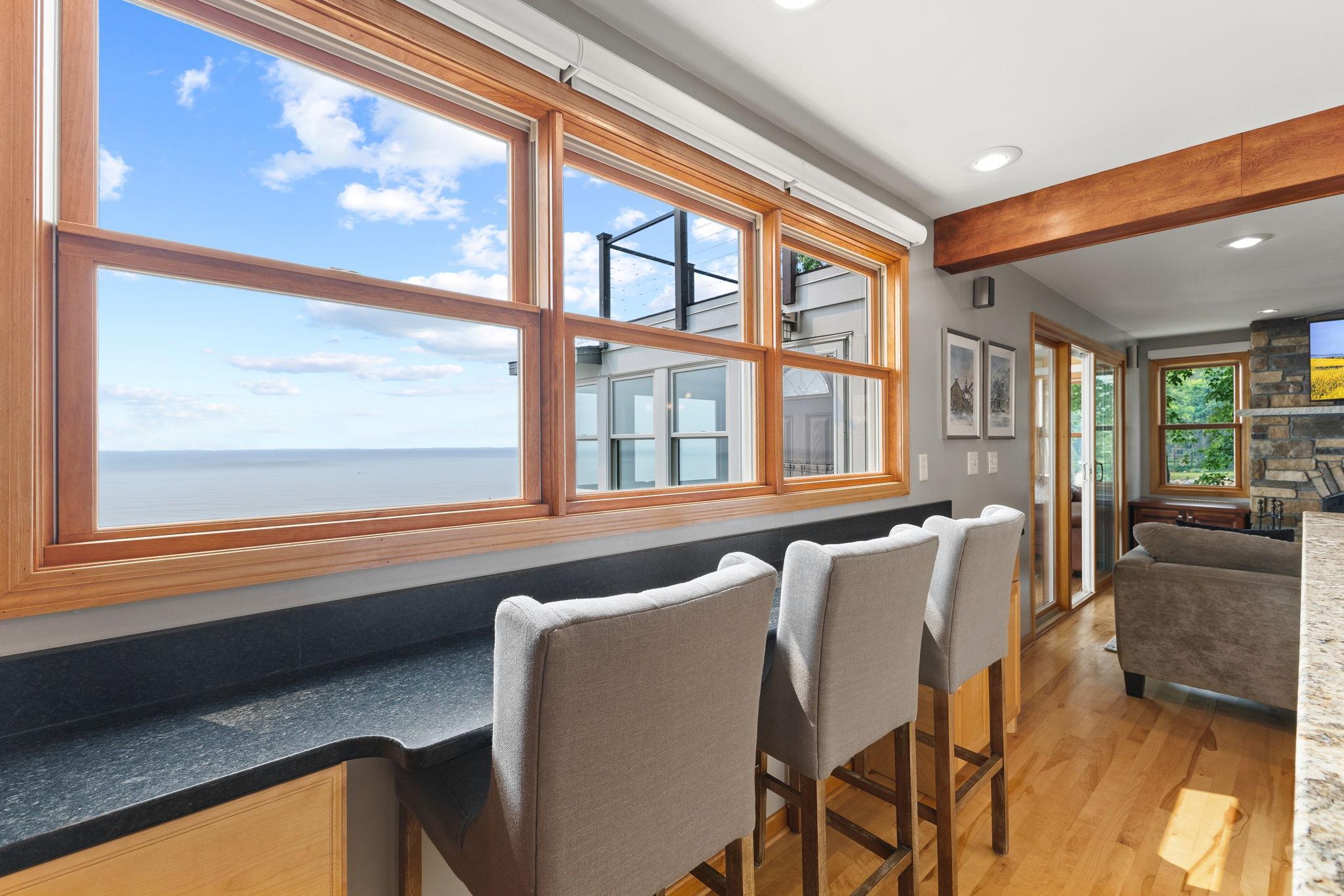 Take in breathtaking west-facing views of Lake Mille Lacs from the eat-in counter, where custom maple cabinetry and premium finishes create the perfect setting for morning coffee or sunset dining.