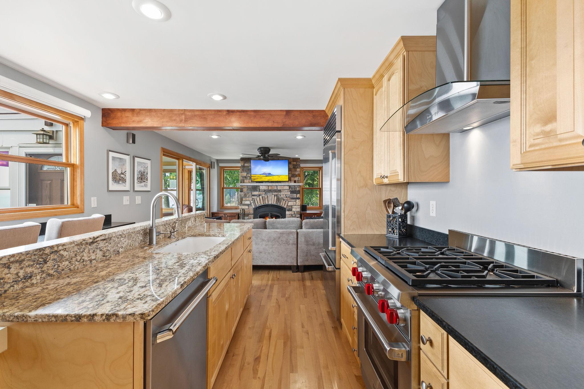 Natural light fills the beautifully renovated kitchen, which opens to the great room for a spacious layout designed with both functionality and entertaining in mind.