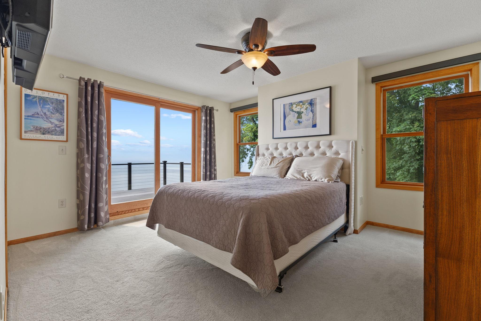 Wake up to breathtaking lake views from the private owner's suite, complete with direct access to a maintenance-free composite deck overlooking the water.