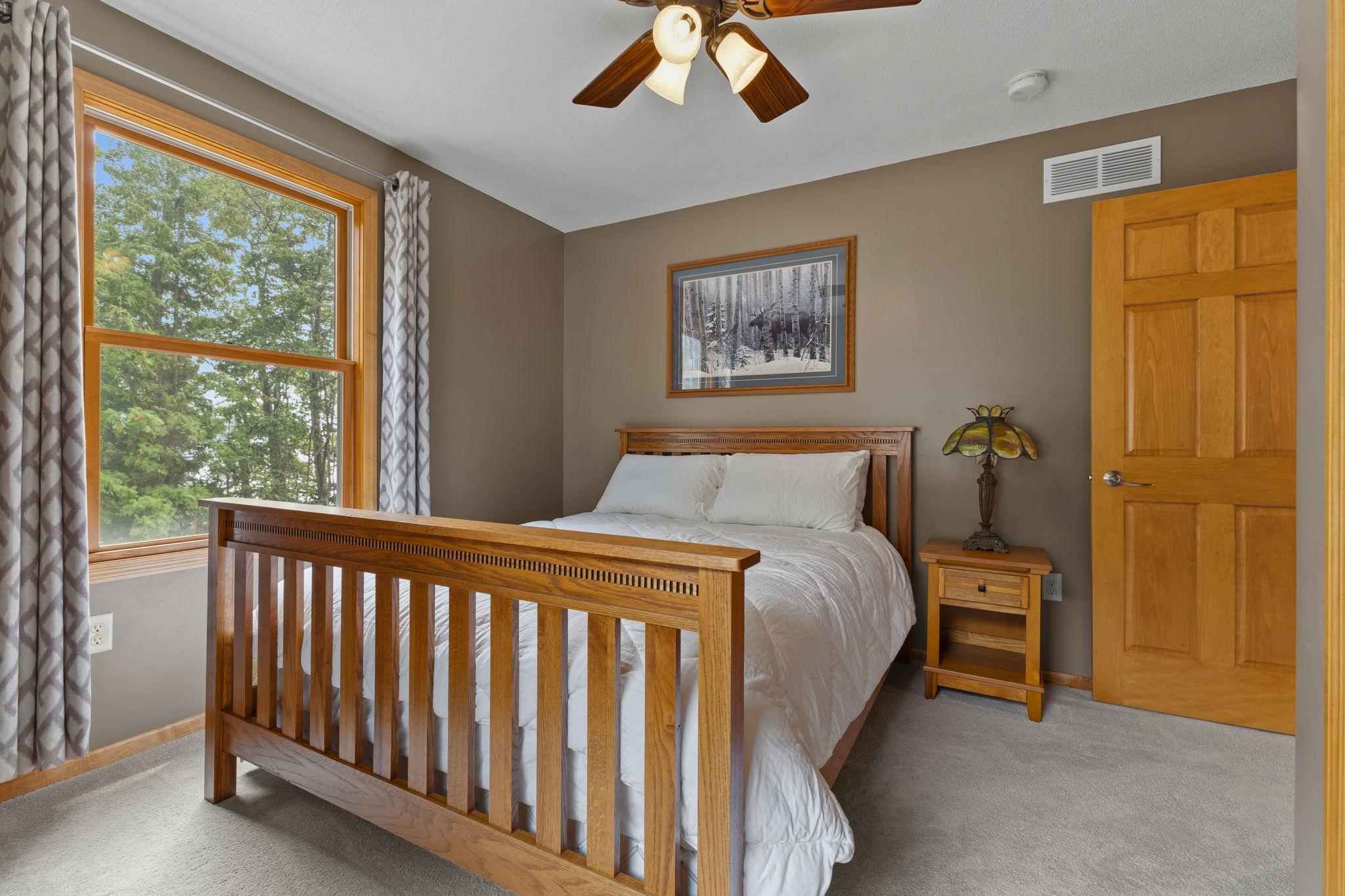2nd guest bedroom overlooking mature trees, offers a peaceful retreat with generous natural light