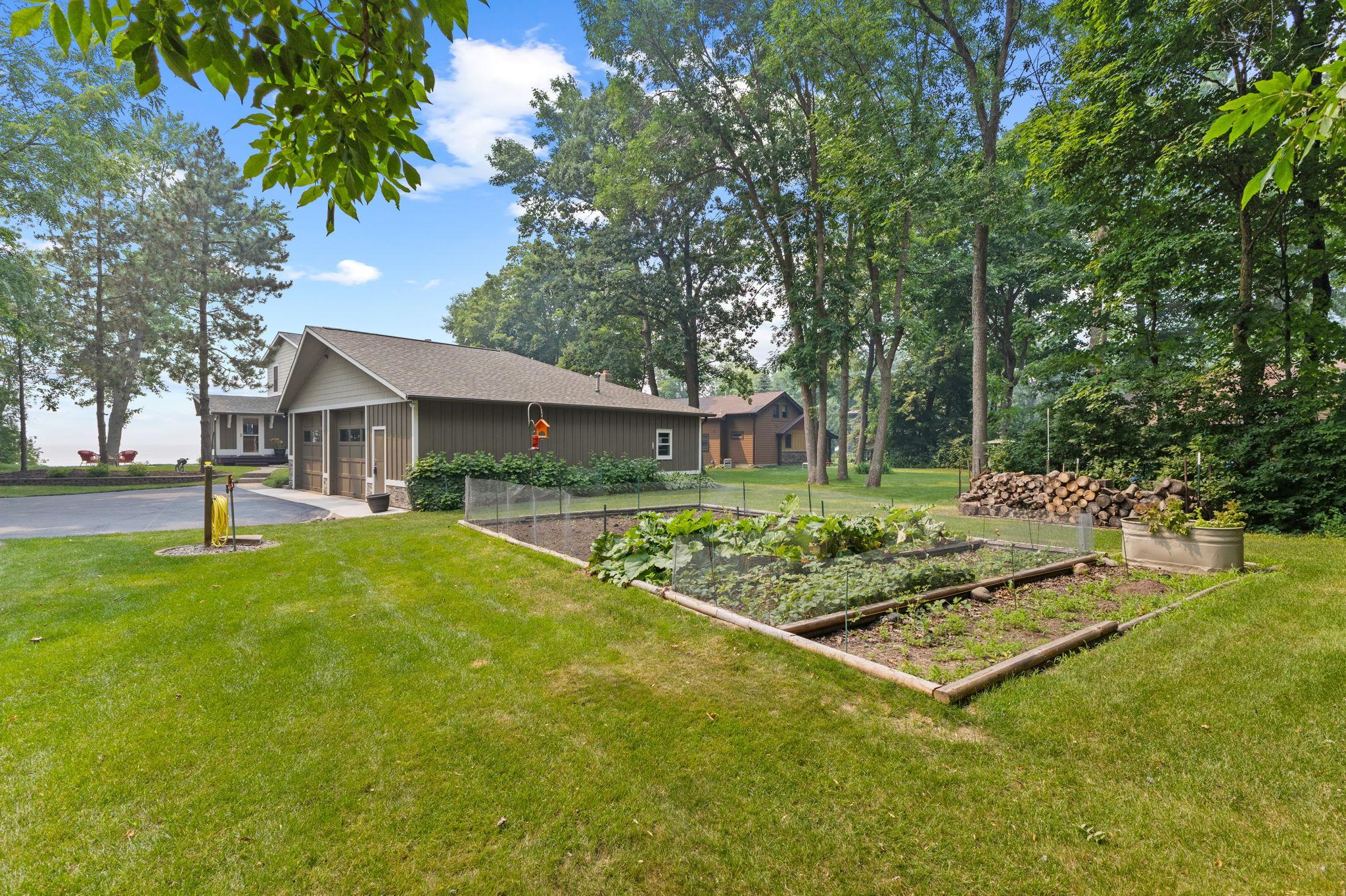 A dedicated garden area adds to the property's charm, providing space to cultivate your own vegetables, herbs, and seasonal flowers.