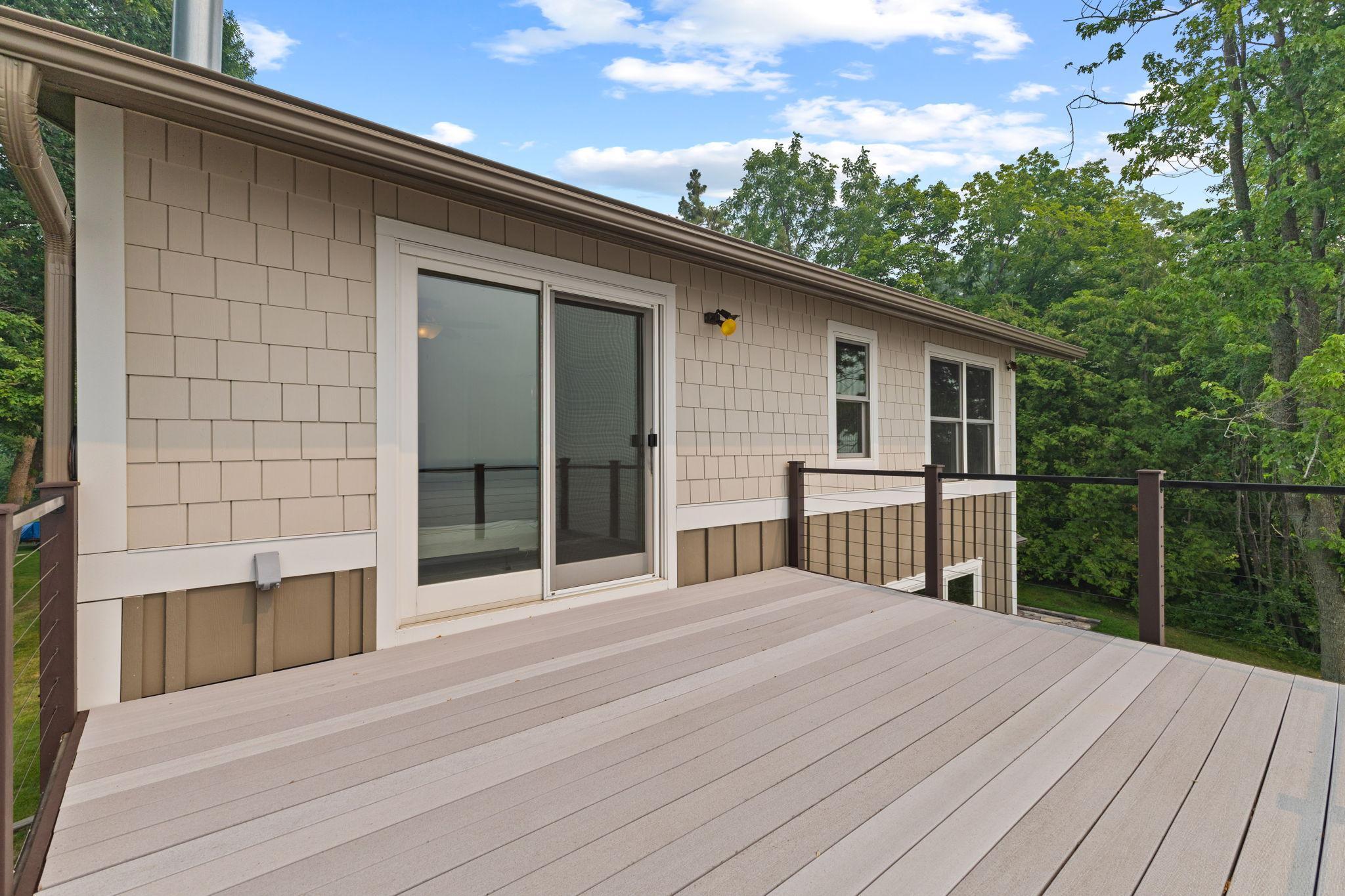 Start your day with coffee or unwind at sunset from this spacious maintenance-free composite deck overlooking the beautiful shoreline!