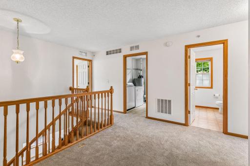 Upper level features 3 bedrooms, laundry room and 2 full baths