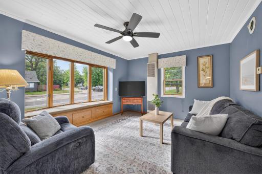 Bright living room featuring a beautiful bay window and plenty of natural light.