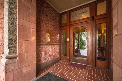 The covered front entrance has a SOLID WOOD security door, and tile flooring with stonework. It's spectacular!